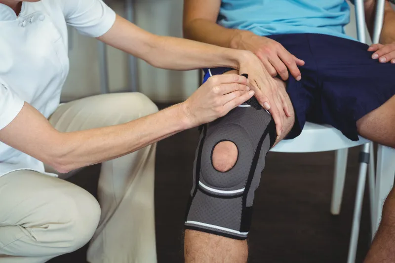 Teenager is fitted with a brace for his Osgood Schlatter Disease knee pain
