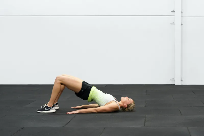 An athlete with Osgood Schlatter Disease exercising to help fix their knee pain