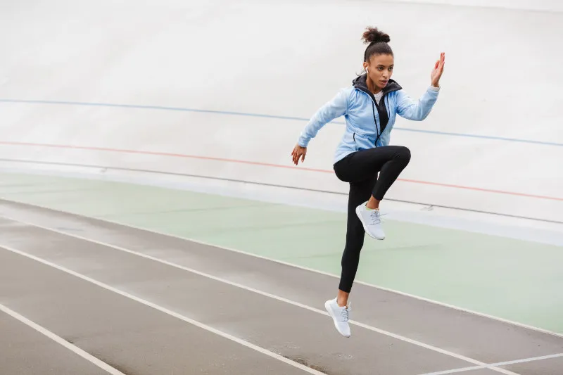 Female athlete performing movement skill drills for osgood schlatter treatment