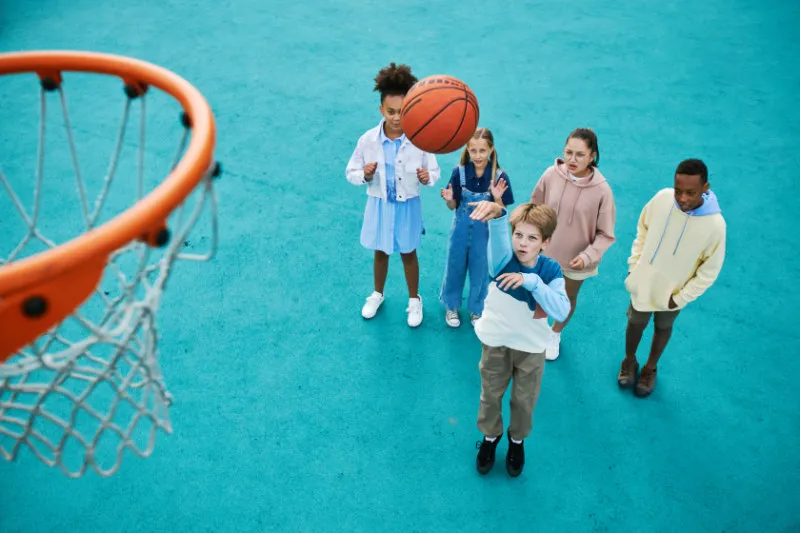 Children performing low intensity basketball practice
